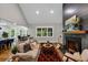 Bright open-concept living room with hardwood floors and a cozy fireplace at 331 Terrell Sw Dr, Marietta, GA 30064
