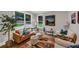Bright living room with stylish furniture, a colorful rug, and large windows offering a comfortable and inviting space at 331 Terrell Sw Dr, Marietta, GA 30064