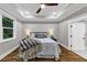Spacious main bedroom boasting tray ceilings, hardwood floors, and a large window at 331 Terrell Sw Dr, Marietta, GA 30064