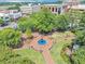 Aerial view of a charming town square featuring a central fountain, benches, and lush landscaping at 331 Terrell Sw Dr, Marietta, GA 30064