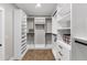 Spacious walk-in closet with custom shelving, drawers and plenty of storage space at 331 Terrell Sw Dr, Marietta, GA 30064
