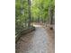 Scenic walking trail in community with mature trees and split rail fence at 331 Terrell Sw Dr, Marietta, GA 30064