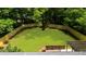 Expansive backyard features new wooden fence, pergola, large grassy area, and mature trees at 3388 Elgin Dr, Decatur, GA 30032