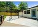 Backyard patio with a pergola, a wooden fence, and a view of the landscaped yard at 3388 Elgin Dr, Decatur, GA 30032