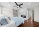 Bedroom featuring a sliding barn door, modern fireplace, and en suite bathroom at 3388 Elgin Dr, Decatur, GA 30032