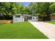 Charming single-story home featuring a well-maintained lawn and a long driveway at 3388 Elgin Dr, Decatur, GA 30032