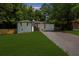 Charming single-story home featuring a well-maintained lawn and a long driveway at 3388 Elgin Dr, Decatur, GA 30032
