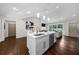 Open-concept kitchen featuring island with stainless steel appliances and seamless access to living area at 3388 Elgin Dr, Decatur, GA 30032