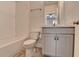 Bathroom featuring white subway tiles in shower and gray vanity with drawers and cabinets at 3879 Glenview Club Ln, Duluth, GA 30097