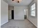 Bright bedroom with plush carpet, ceiling fan, closet and ensuite bathroom access at 3879 Glenview Club Ln, Duluth, GA 30097