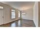 Dining area showcasing hardwood floors, elegant chandelier, and natural light at 3879 Glenview Club Ln, Duluth, GA 30097