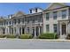 Row of beautifully designed townhomes with a well-kept exterior and lush greenery at 3879 Glenview Club Ln, Duluth, GA 30097