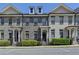 Charming brick townhomes with well-maintained landscaping and inviting front entrances at 3879 Glenview Club Ln, Duluth, GA 30097