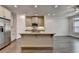 Open concept kitchen with stainless appliances, granite counters, and hardwood floors at 3879 Glenview Club Ln, Duluth, GA 30097