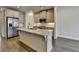 Modern kitchen with stainless steel appliances, granite countertops, and a central island with a sink at 3879 Glenview Club Ln, Duluth, GA 30097