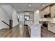 Modern kitchen with stainless appliances, granite counters, hardwood floors, and bright lighting at 3879 Glenview Club Ln, Duluth, GA 30097