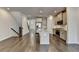 Open kitchen with island, hardwood floors and stainless steel appliances at 3879 Glenview Club Ln, Duluth, GA 30097