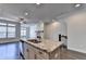 Open concept kitchen with granite island, stainless appliances, recessed lighting, and hardwood floors at 3879 Glenview Club Ln, Duluth, GA 30097
