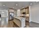 Open concept kitchen with stainless appliances, granite counters, and hardwood floors at 3879 Glenview Club Ln, Duluth, GA 30097