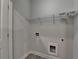 Laundry room with white walls, tile floor, utility connections, and white door at 3879 Glenview Club Ln, Duluth, GA 30097