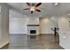 Open-concept living room featuring a stone fireplace and hardwood floors at 3879 Glenview Club Ln, Duluth, GA 30097