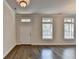 Bright living room featuring hardwood floors, natural light, and a welcoming entrance at 3879 Glenview Club Ln, Duluth, GA 30097