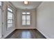 Sunroom with natural light from the three windows and door to the deck at 3879 Glenview Club Ln, Duluth, GA 30097