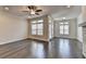 Spacious living room featuring hardwood floors, recessed lighting, and access to the outside at 3879 Glenview Club Ln, Duluth, GA 30097