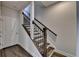 Wooden staircase with iron spindles and light-colored walls leads to the upper level at 3879 Glenview Club Ln, Duluth, GA 30097