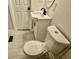Cozy bathroom featuring a toilet, vanity with storage, and modern fixtures at 559 Allgood Rd, Stone Mountain, GA 30083