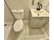 Bathroom featuring a toilet, modern sink, and vanity with storage at 559 Allgood Rd, Stone Mountain, GA 30083
