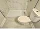Bathroom featuring modern shower and toilet at 559 Allgood Rd, Stone Mountain, GA 30083