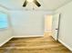 Bedroom features wood-look floors and a ceiling fan at 559 Allgood Rd, Stone Mountain, GA 30083