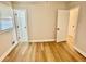 Bedroom with wood-look flooring and a window letting in natural light at 559 Allgood Rd, Stone Mountain, GA 30083