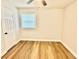 Bedroom features wood-look floors and a ceiling fan at 559 Allgood Rd, Stone Mountain, GA 30083