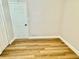 Bedroom featuring hardwood floors and a door at 559 Allgood Rd, Stone Mountain, GA 30083