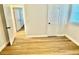 Bright bedroom featuring luxury vinyl plank flooring and neutral paint tones at 559 Allgood Rd, Stone Mountain, GA 30083