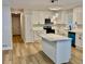 Bright, open kitchen with white cabinets, updated countertops, and stainless steel appliances at 559 Allgood Rd, Stone Mountain, GA 30083