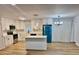 Bright kitchen with white cabinets, stainless steel appliances, and a large kitchen island at 559 Allgood Rd, Stone Mountain, GA 30083