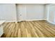 Open living space with hardwood floors and a sliding glass door providing ample natural light at 559 Allgood Rd, Stone Mountain, GA 30083