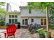 Charming backyard area with stone patio, string lights, and well-maintained landscaping for outdoor enjoyment at 6520 Fairfield Trce, Suwanee, GA 30024