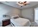 Comfortable bedroom with soft carpet, natural light, side tables with lamps, and neutral decor at 6520 Fairfield Trce, Suwanee, GA 30024
