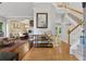 Inviting foyer with hardwood floors, staircase, and stylish decor creating a warm welcome at 6520 Fairfield Trce, Suwanee, GA 30024