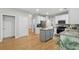 Spacious kitchen with granite countertops, stainless steel appliances, and hardwood floors at 6520 Fairfield Trce, Suwanee, GA 30024