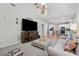 Open living room with a view of the kitchen, hardwood floors, and vaulted ceilings at 6520 Fairfield Trce, Suwanee, GA 30024