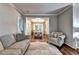 Comfortable living room showcasing hardwood floors and an open view of the elegant dining area at 6520 Fairfield Trce, Suwanee, GA 30024