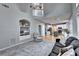 Open-concept living space with plush carpeting and smooth hardwood floors throughout the home at 6520 Fairfield Trce, Suwanee, GA 30024