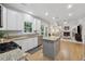 Bright kitchen opens to a cozy living room with a fireplace and lots of natural light at 6520 Fairfield Trce, Suwanee, GA 30024