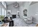 Bright living room with vaulted ceilings, a fireplace, built-in shelves, and carpeted floors at 6520 Fairfield Trce, Suwanee, GA 30024