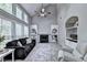Open-concept living room with vaulted ceilings, a fireplace, built-in shelves, and plush carpet flooring at 6520 Fairfield Trce, Suwanee, GA 30024